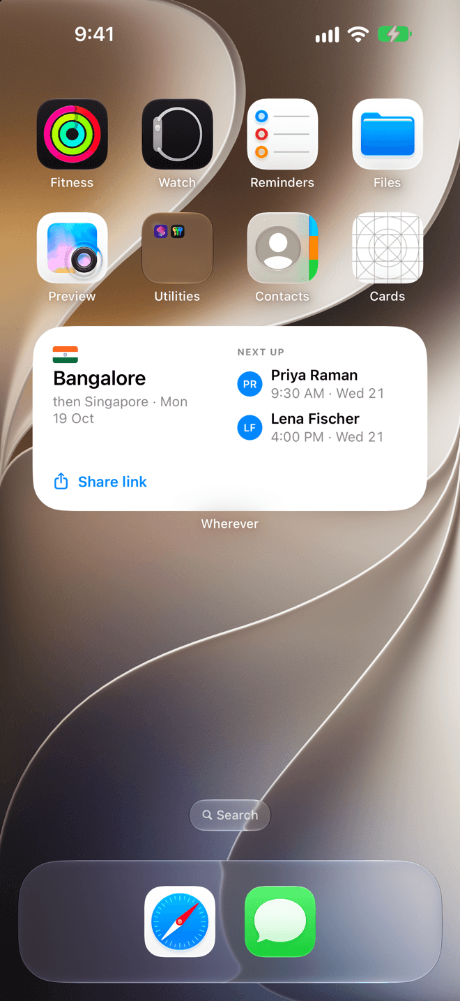 An iPhone home screen with the Wherever widget: Bangalore, then Singapore from Monday 19 October, next up Priya Raman at 9:30 AM Wednesday